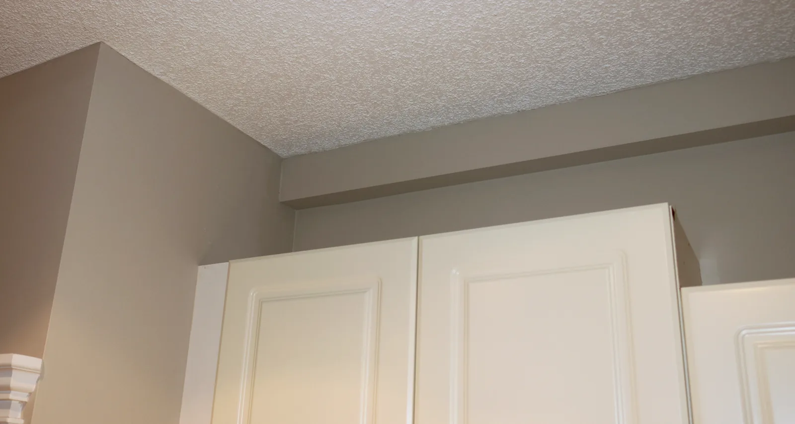 Plumbing Track enclosure running above existing kitchen cabinets