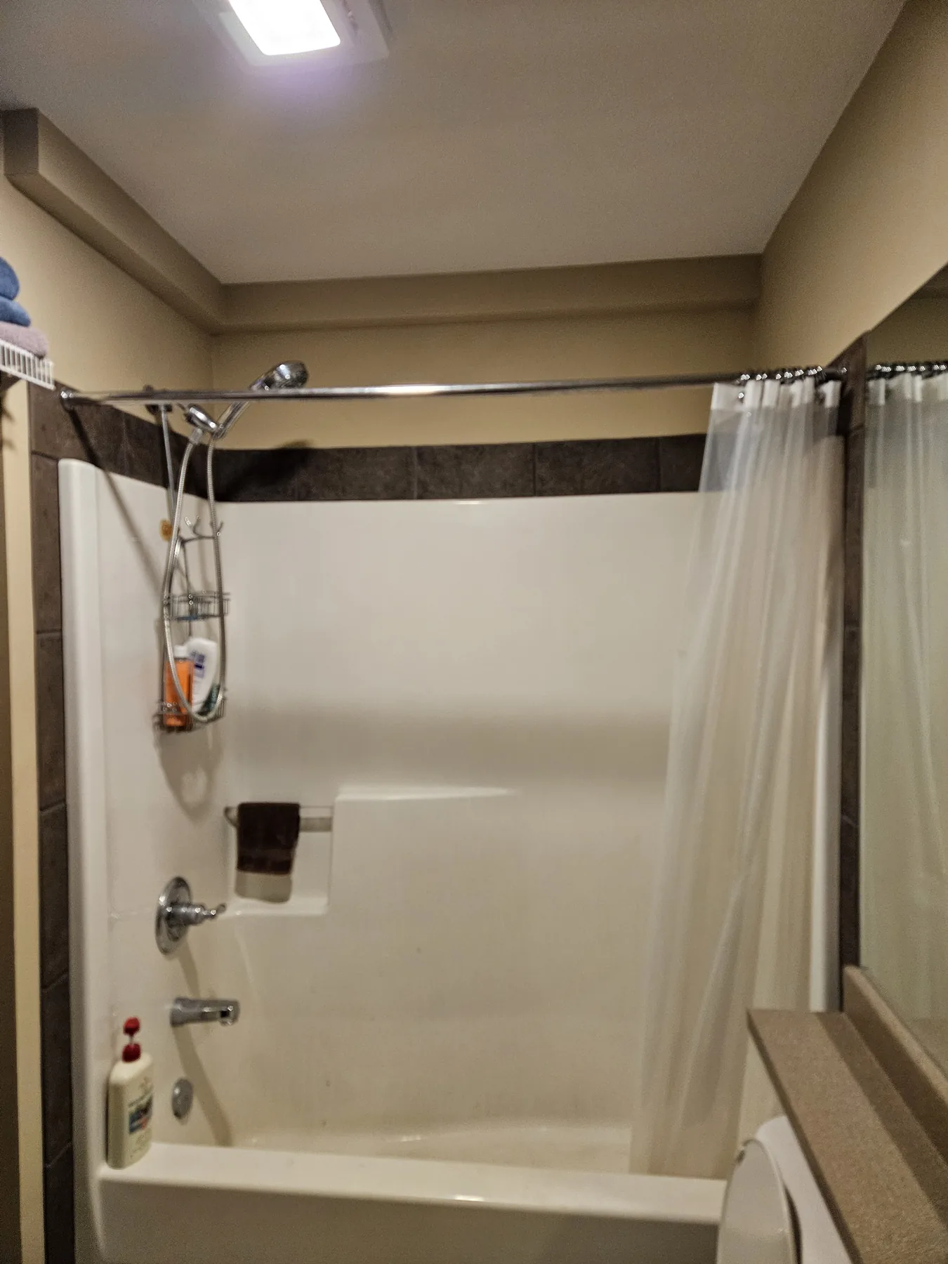 Finished Plumbing Track enclosure integrated around a bathroom perimeter